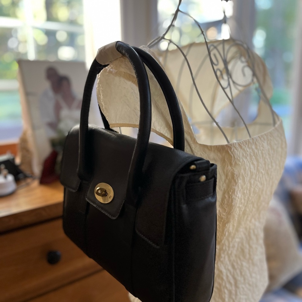 New leather bag with metal clasp .Never used.